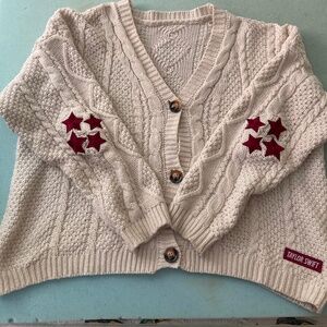 Taylor Swift cardigan (in the color maroon)